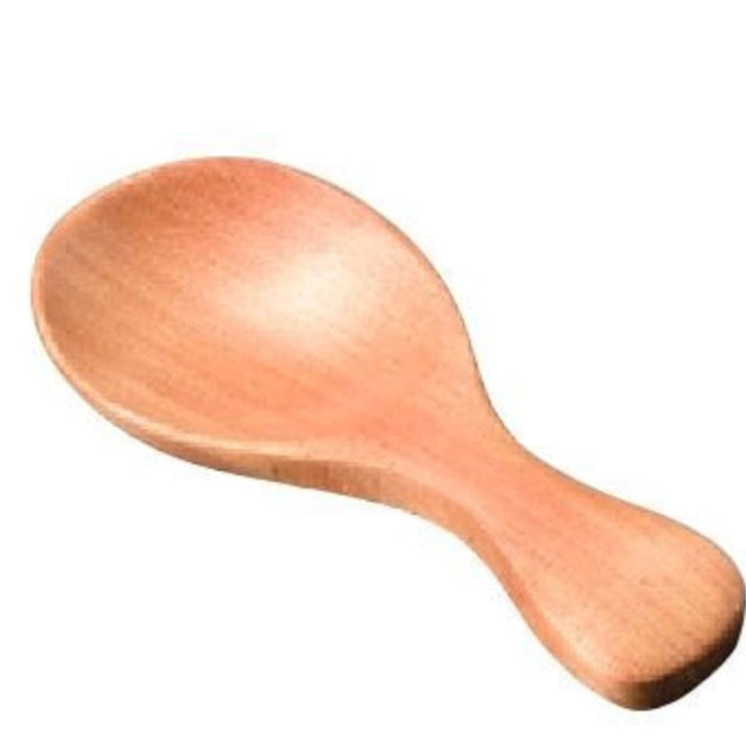 Wooden spoon on a white background