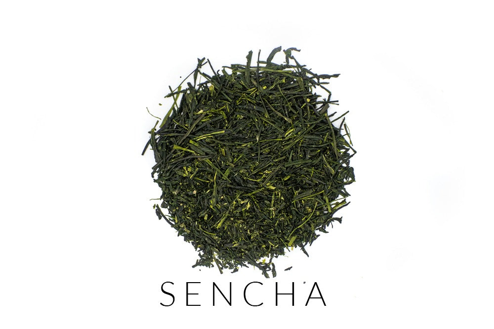Needle-shaped and deep emerald premium sencha green tea leaves from Yame, Japan, in a circle shape. Under the leaves, the word SENCHA is written.