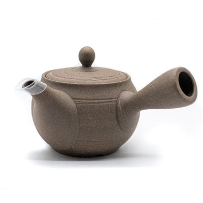 Front of light-brown clay Japanese tea pot (kyusu) made in Tokoname, with a side handle.