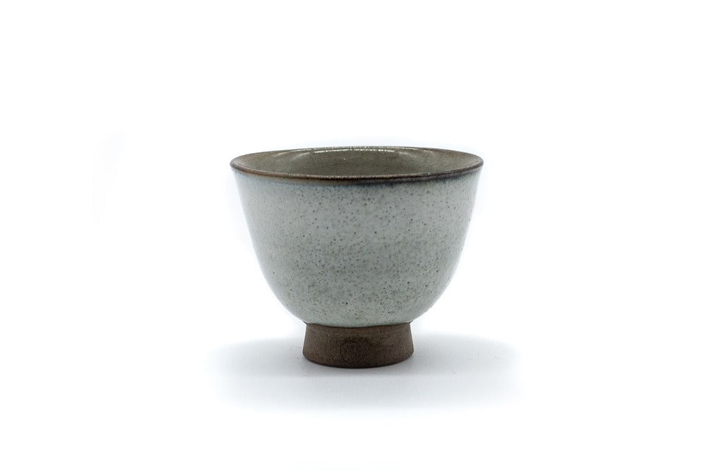 Front side of a small and delicate grey handmade cup for drinking gyokuro green tea, made in Koishiwara, Fukuoka, Japan by Onimaru the Second