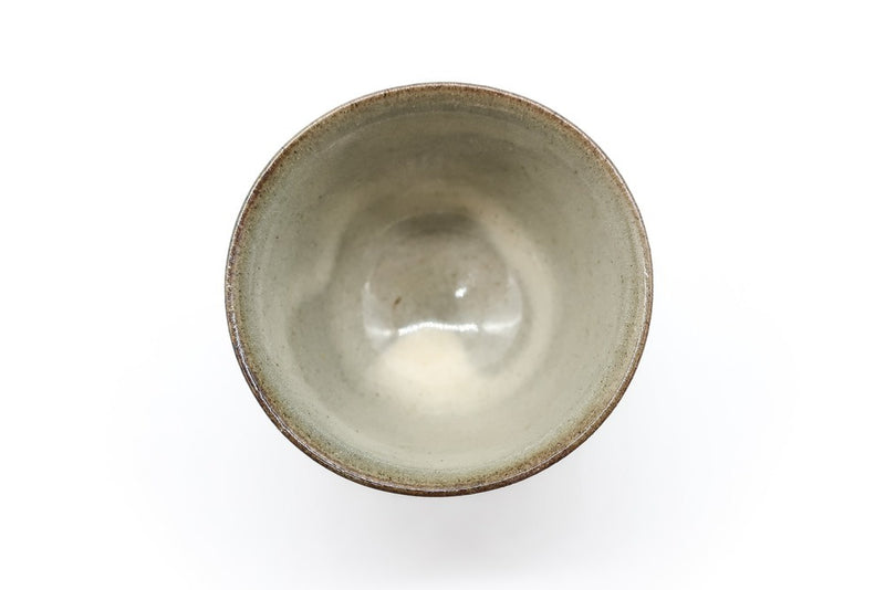 A picture of the inside of a small and delicate grey and brown handmade cup for drinking gyokuro green tea, made in Koishiwara, Fukuoka, Japan by Onimaru the Second